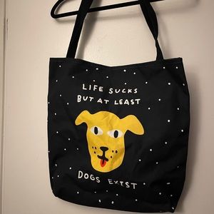 “Life Sucks But At Least Dogs Exist” tote bag
